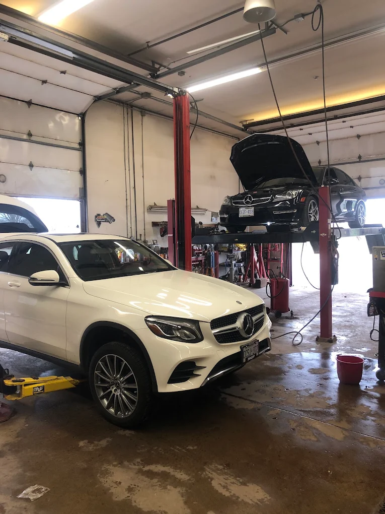 Vehicles in the service bays at Pete's Muffler in Guelph for air conditioning service