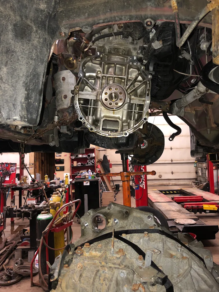 Transmission removed from a vehicle with the bellhousing exposed during gearbox work
