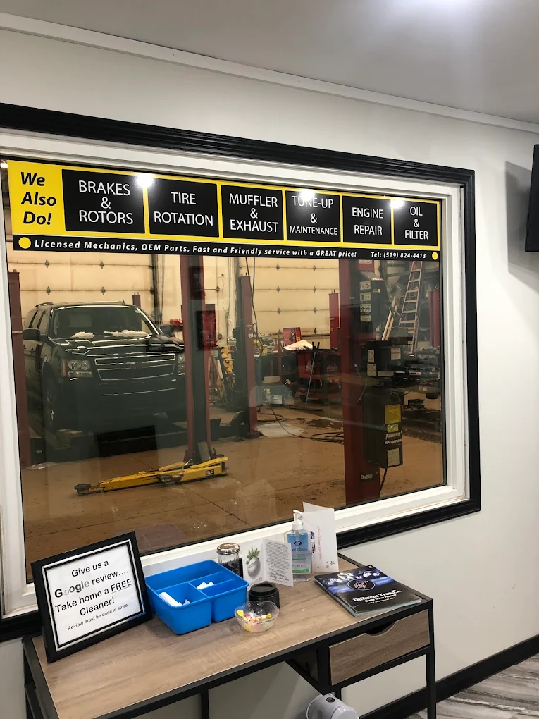 Waiting area at Pete's Muffler showing the sign offering a free cleaner for leaving a Google review